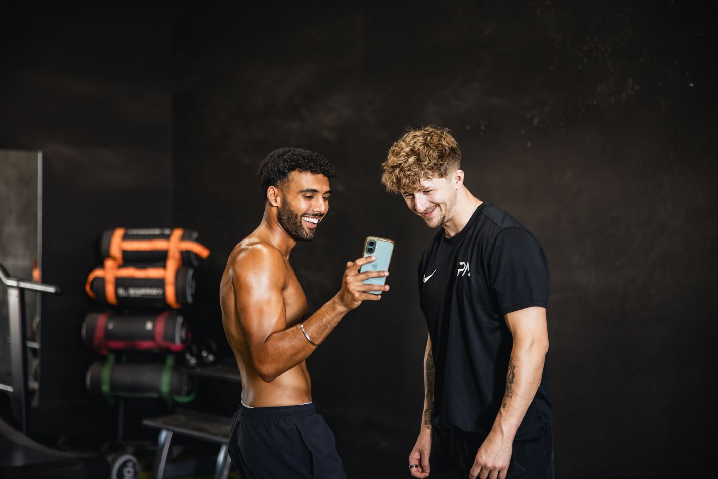 Coach and client looking through the shoot photos on a phone